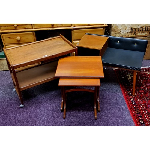 628 - A mid 20th century teak telephone seat;  a nest of two G plan side tables; a teak trolley (3)