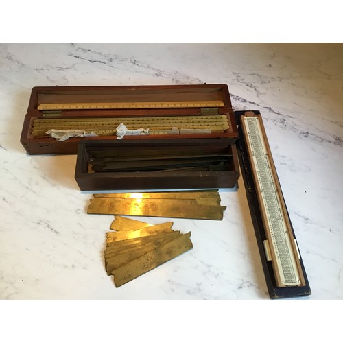 45 - A slide rule;  set of rulers;  brass drawing instruments;  etc