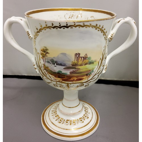 105 - A Victorian Coalport type  two handled loving cup, painted with landscape cartouches within a g... 