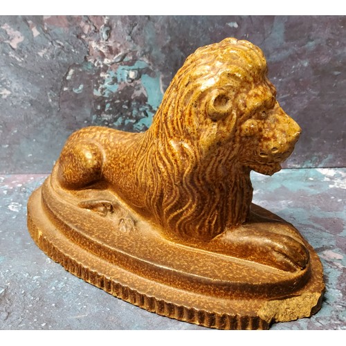 127 - A 19th century Derbyshire salt glazed stoneware model, of a lion, oval base, 16cm wide, c.1890