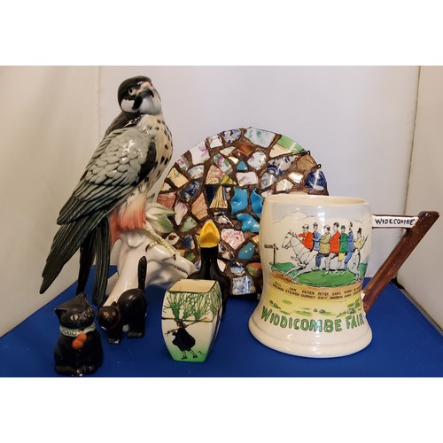 132 - A Fieldings Crown Devon, Widdicombe Fair musical mug, printed marks;   a German model, Bird of Prey,... 