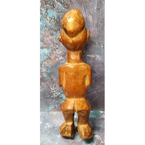 161 - An African tribal figure, of a bearded man, standing, 30cm high