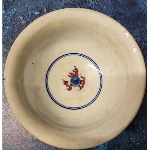 179 - A 19th century Chinese bowl, the exterior in cobalt blue with the dragon chasing the flaming pearl, ... 