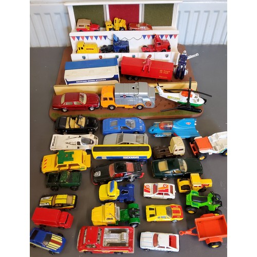 237 - Diecast Vehicles - Corgi, Matchbox, etc, all playworn;  a home made stand;  etc