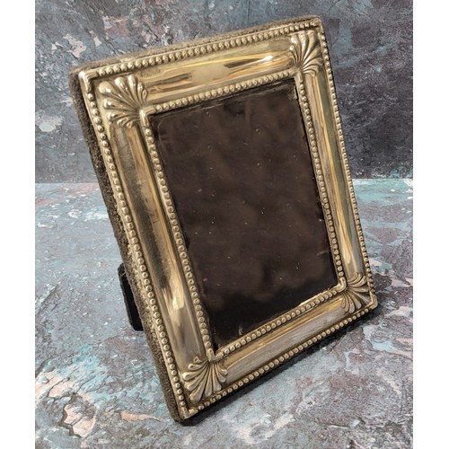 292 - A silver rectangular easel photograph frame, anthemion to angles, 12cm x 10cm, Sheffield 1996