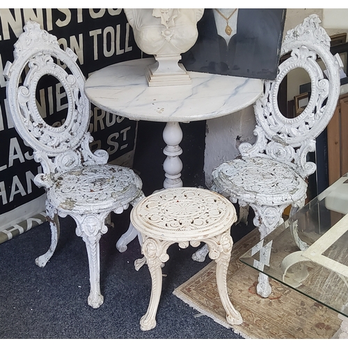 401 - A pair of Coalbrookdale style medallion back garden chairs, painted white with conforming footstool ... 