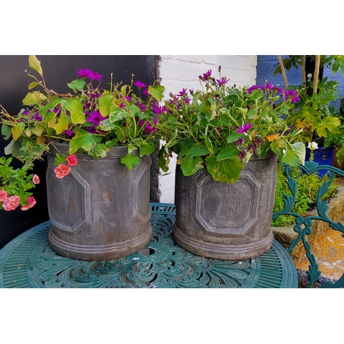 411 - A pair of cylindrical faux lead planters