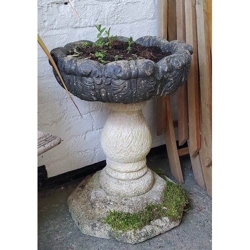 417 - A reconstituted stone pedestal acanthus capped planter / urn