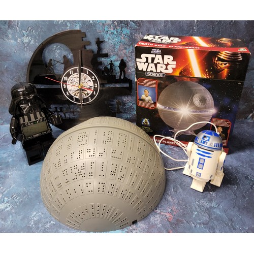 397 - A Star Wars Lego Darth Vader alarm clock, 24cms; a boxed Star Wars Science Death Star Planetarium; a... 