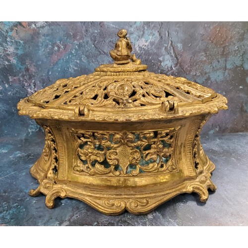 42 - An early 20th-century gilt metal waisted oval pierced casket, the slightly domed cover with figural ... 