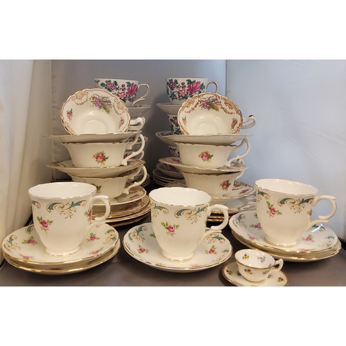 66 - A Royal Doulton tea service, for six, printed with roses,  Cupids's bow and arrow and gilt swags, pr... 