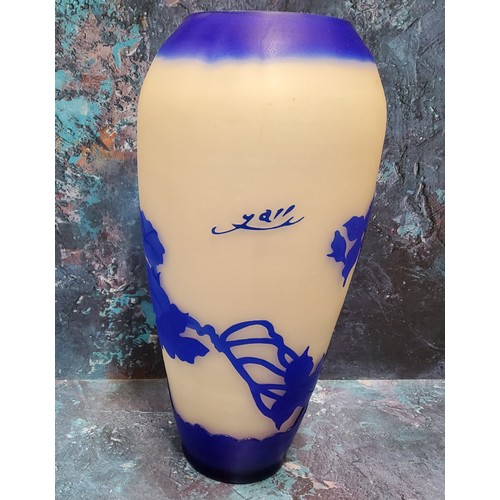 16 - An Art Glass ovoid vase, etched with in blue with honeysuckle, on a white ground,  bears signature G... 