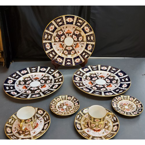 134 - Three Royal Crown Derby 2541 pattern dinner plates; two similar coffee cans and saucers;  two other ... 