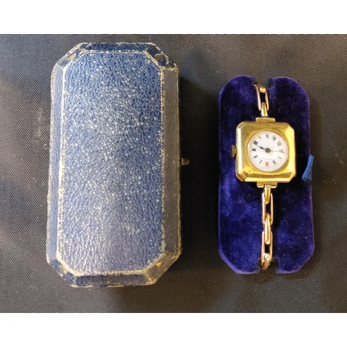 293 - An unsual late 19th/early 20th century 15ct gold lady's watch, the cantered square case with a circu... 