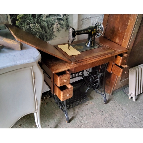 767 - An early 20th century Singer sewing machine trestle table