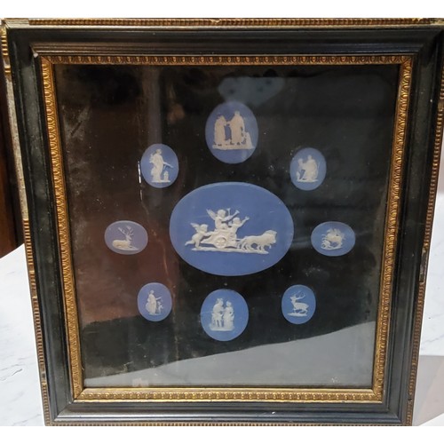 38 - A set of nine 19th century oval Wedgwood blue jasper cameos, various sizes, framed as one