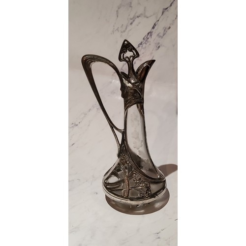 47 - A W.M.F. liqueur decanter, applied with sinuous lines and foliage, 25cm high, c.1910