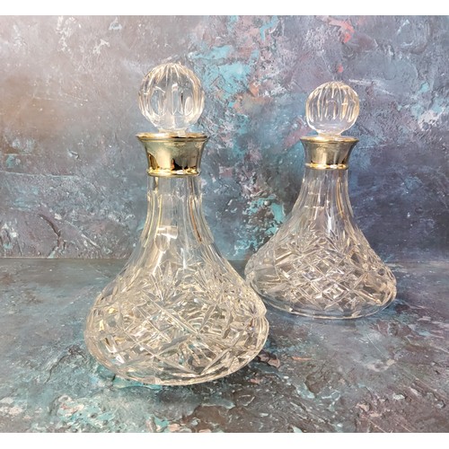 48 - A pair of silver mounted decanter, globular stoppers, 28cm high,  James Dixon & Sons, Birmingham... 