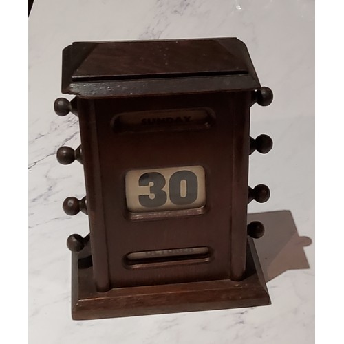 49 - An early 20th century oak perpetual desk calendar, 17cm high, c.1920