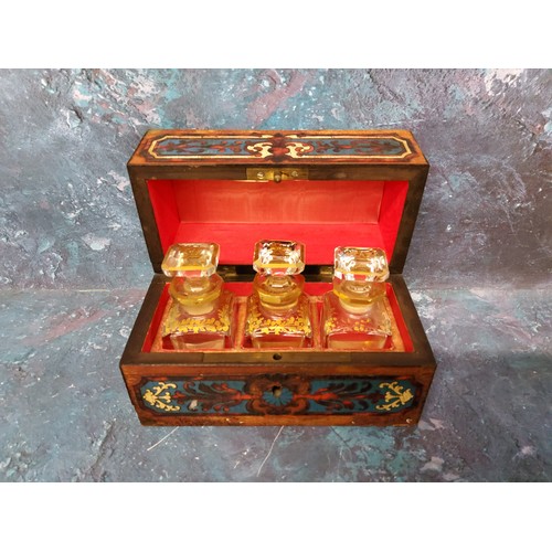 51 - A 19th century French Boulle and ebonised scent casket,  enclosing three clear glass bottles outline... 