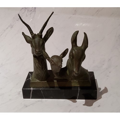 55 - Art Deco, a green patinated bronze, deer family group, heads, rectangular marble base, 19cm high