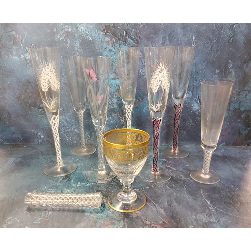 63 - A champagne flutes, engraved and enamelled with butterfly and grasses, air twist stem, 27cm high;  o... 