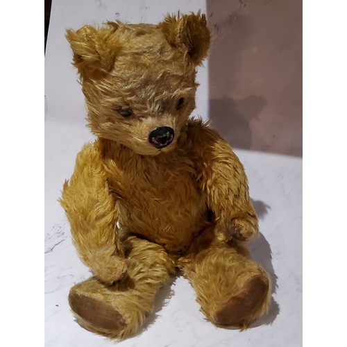 66 - An English jointed mohair bear, stitched nose and mouth, velveteen pads, 47cm high, c.1930