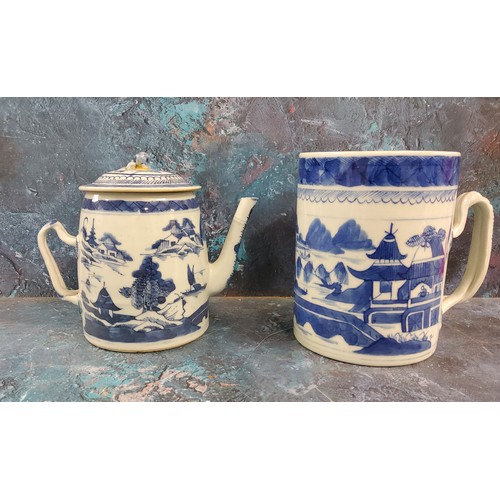 86 - A late 18th/early 19th century  Chinese mug, decorated in underglaze blue with pagodas, bridge ... 