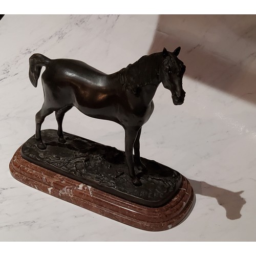 87 - After Mene, a dark patinated bronze,  horse standing, rouge marble base, 21cm high