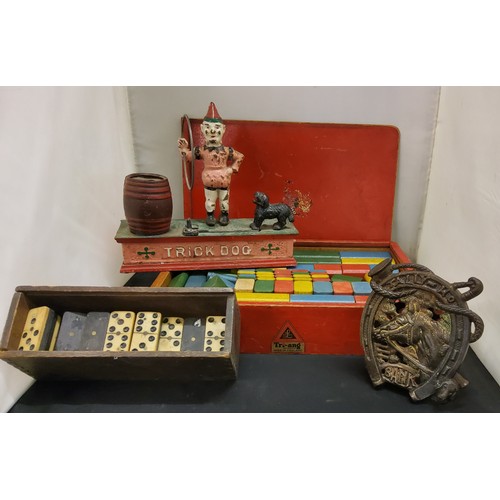 156 - Tri-ang coloured blocks, c.1930;  bone dominos; early 20th century cast iron Tally Ho money box... 