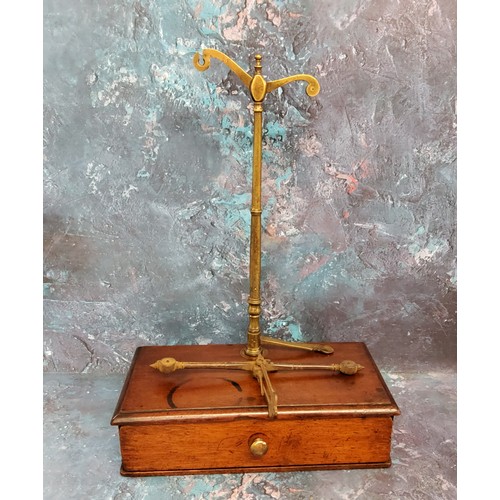 191 - A set of 19th century  brass beam balance scales, mahogany stand, with drawer, 25cm wide, 14cm dee