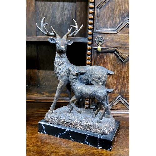 151 - Libra Company, bronzed resin, Red Deer and Fawn, faux black marble rectangular base, 39cm high