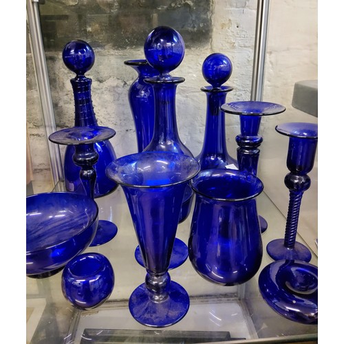 192 - A 20th century Bristol Blue decanter and stopper, 31cm high;  others;  similar vases, candlesticks, ... 