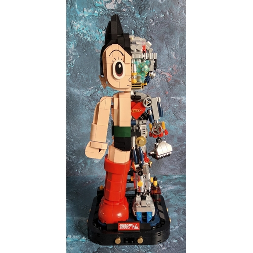 738 - A Lego style Tezuka Productions 86203 Astro Boy Mechanical Clear Version, built with original instru... 