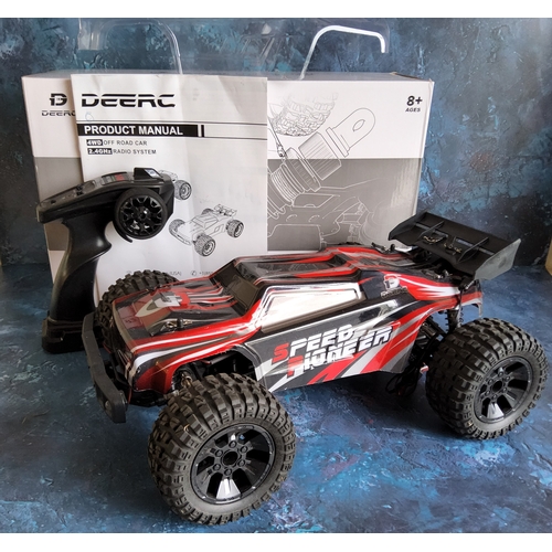 751 - A DEERC 9206E 4WD 1:10 scale Remote Control Truck with an extra clear shell, built, with contoller i... 