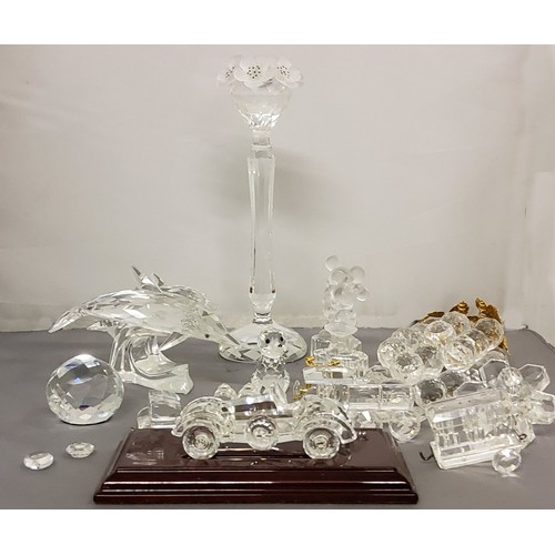 27 - Swarovski - a dolphin;  candlestick;  train;  other glassware similar, Mickey and Min... 