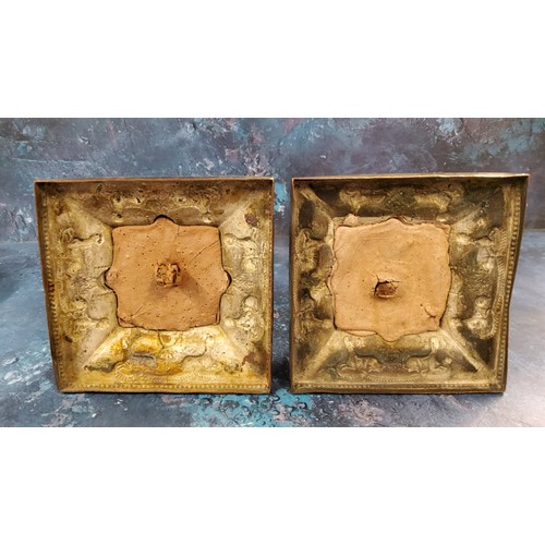 2 - A pair of Sheffield Plated Egyptian Revival table candlesticks, urn shaped sconces, embossed with sw... 