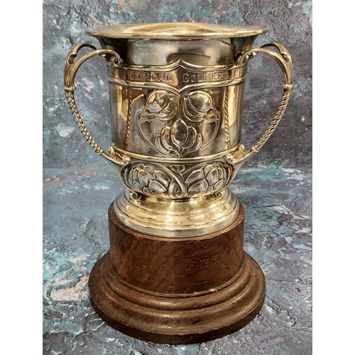 107 - An Edwardian silver three handled trophy tyg, embossed with Art Nouveau stylised buds and scrolls, d... 