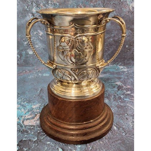 107 - An Edwardian silver three handled trophy tyg, embossed with Art Nouveau stylised buds and scrolls, d... 