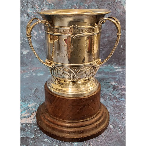 107 - An Edwardian silver three handled trophy tyg, embossed with Art Nouveau stylised buds and scrolls, d... 