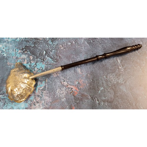 137 - A George III toddy ladle, the bowl embossed with leaves and foliage, turned handle, 33cm long, Londo... 