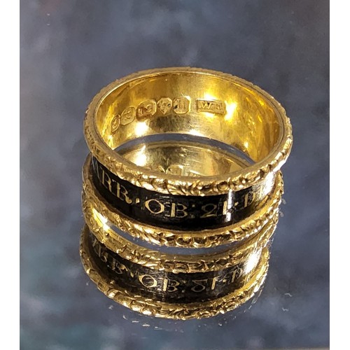 157 - A George IV 18ct mourning ring, a 8mm wide the gold band with recessed black enamel centre with lett... 