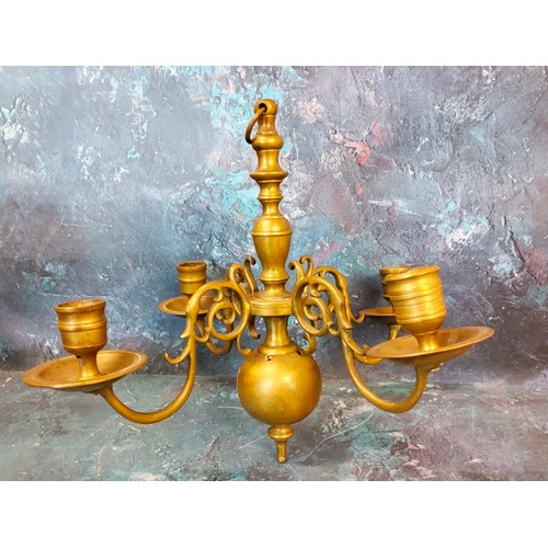 465 - An 18th century Dutch style brass four light ceiling candle holder, 28cm high