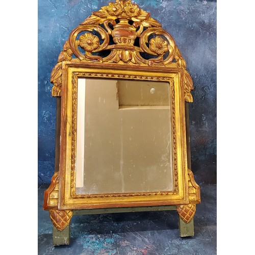 440 - A giltwood rectangular mirror, the arched cresting pierced and carved with flowers in an urn, 67cm x... 