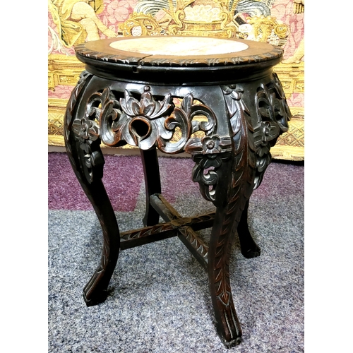 435 - A 19th century Chinese hardwood jardiniere stand, circular top inset with a well figured marble pane... 