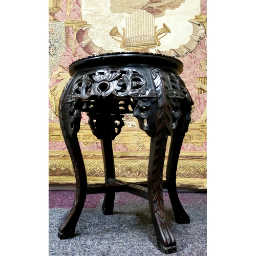 435 - A 19th century Chinese hardwood jardiniere stand, circular top inset with a well figured marble pane... 