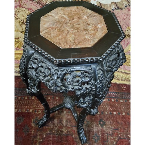 397 - A Chinese carved hardwood jardiniere stand, octagonal marble inset panel c.1900