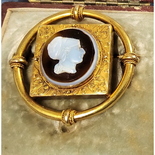 191 - Attributed John Brogden, a Victorian yellow metal Etruscan style shell cameo mourning brooch, the ce... 