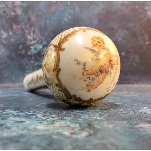 210 - A Victorian porcelain parasol handle, decorated with cherubs within a gilt cartouche, on a white gro... 