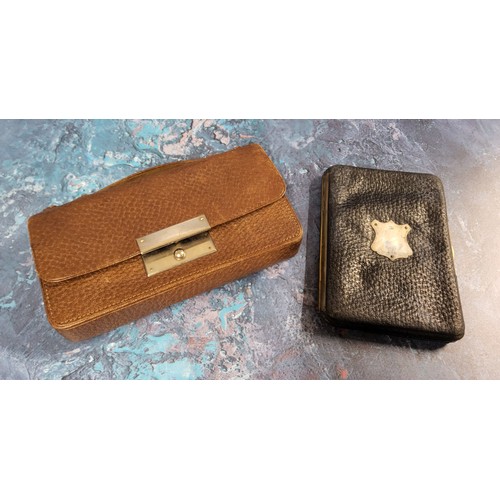 216 - An early 20th century red morocco leather stationery case,  writing surface, stamp and paper pouches... 